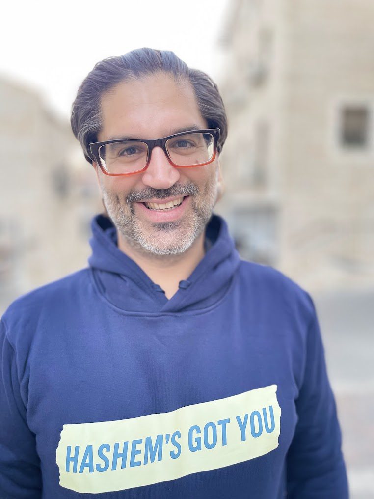 Amir Lehrer wearing Hashem’s Got You hoodie